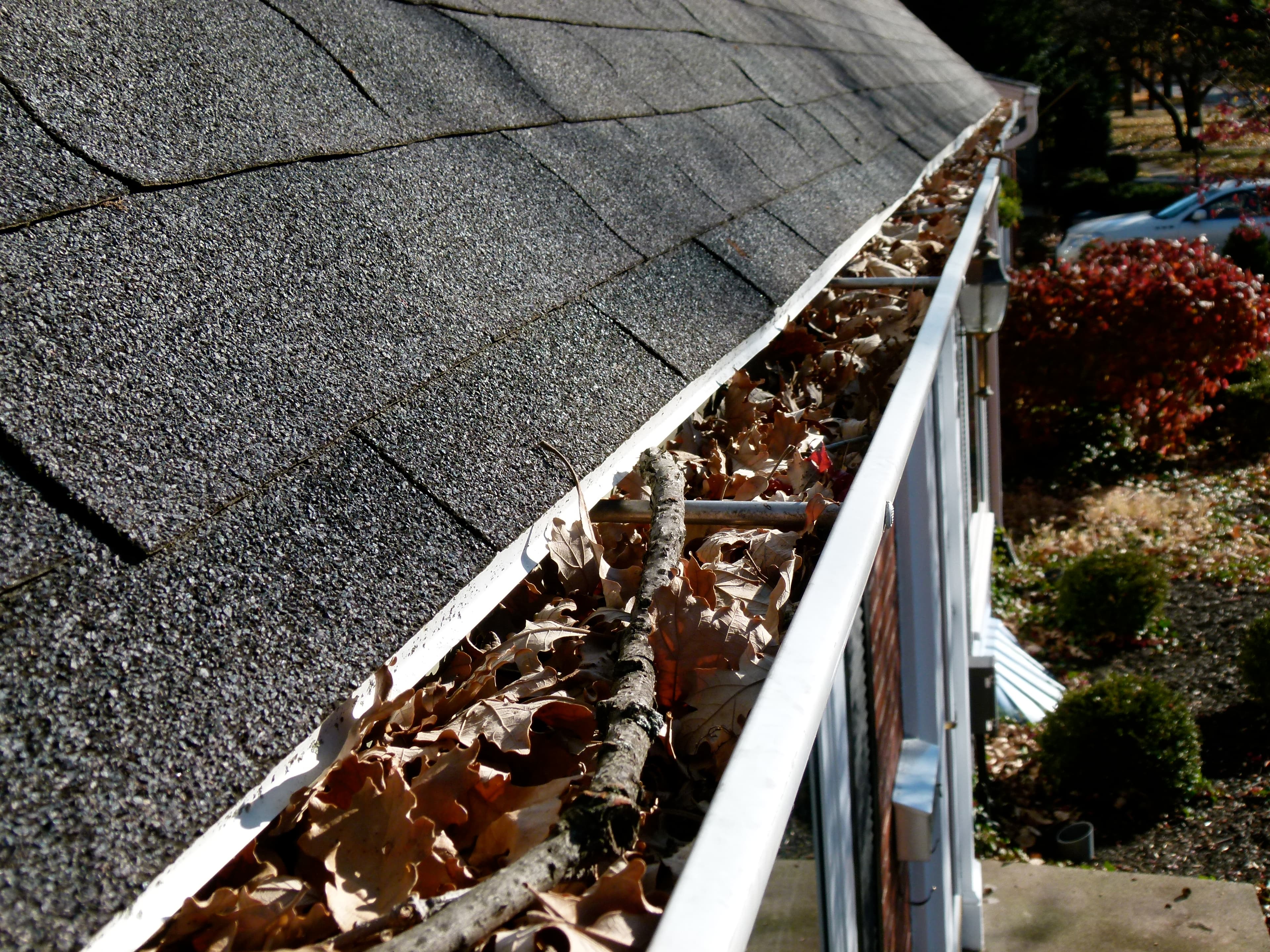 Clearing debris from gutters